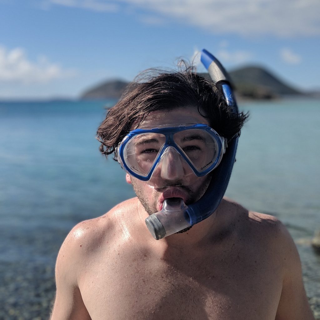A man with a snorkel mask on