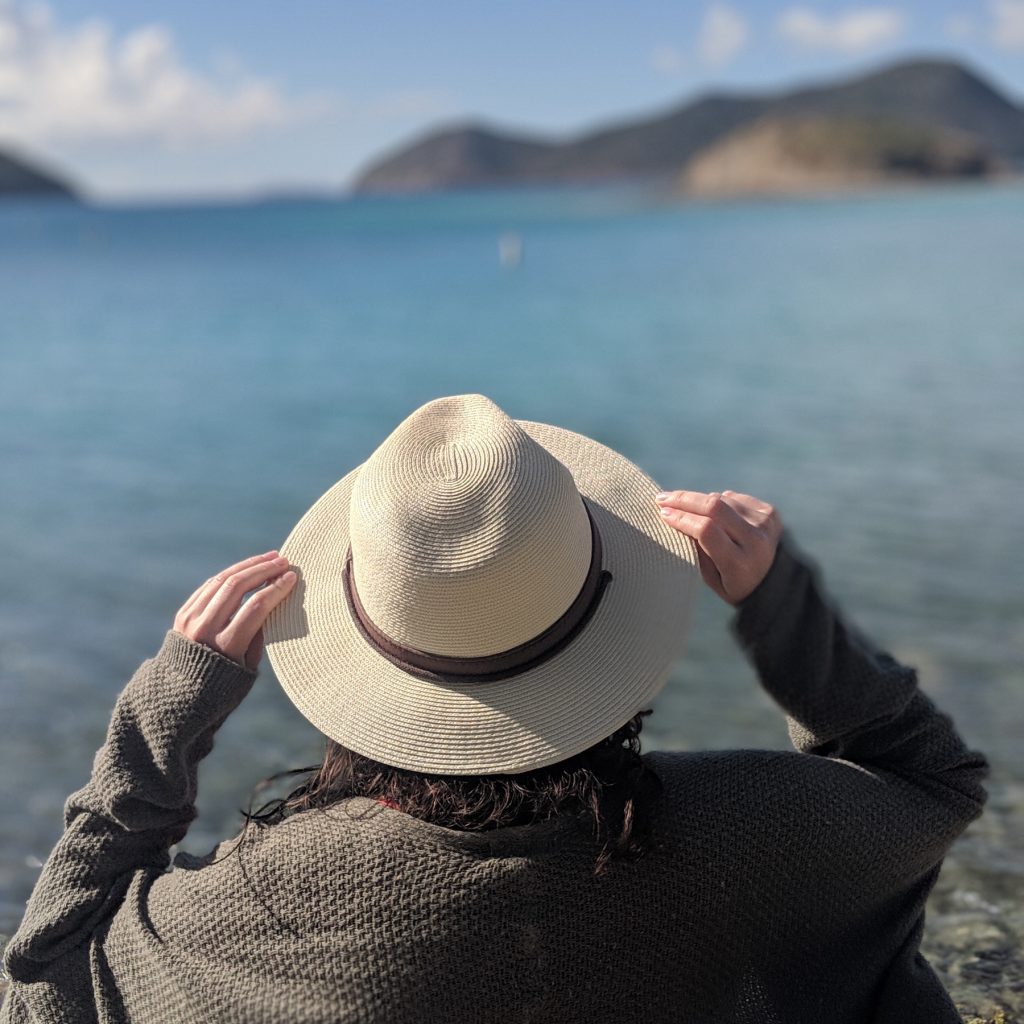 Woman with a hat on looking at the USVI
